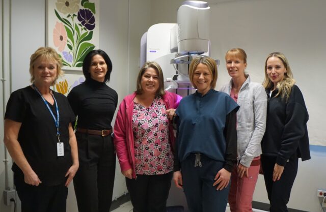 GHC’s President & CEO, Manager of Diagnostic Imaging, and Medical Radiation Technologists stand alongside the newly purchased Mammography Unit (left to right: Kim Cadham, Lil Silvano, Tammy Nye, Kristy Brown, Abby Laity and Emily Chilelli)