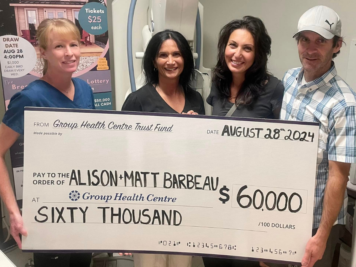 2024 Bunkie Lottery Winners holds cheque for $60,000